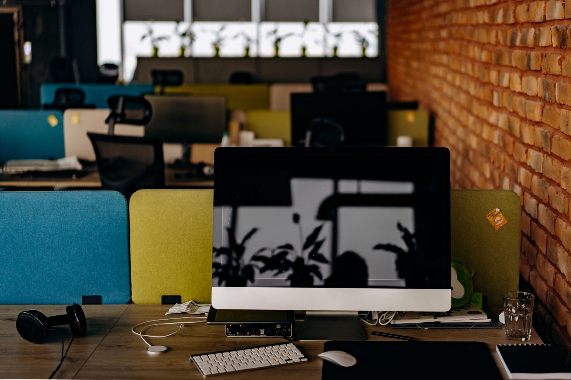 Empty office desk and chair symbolizing workforce reduction