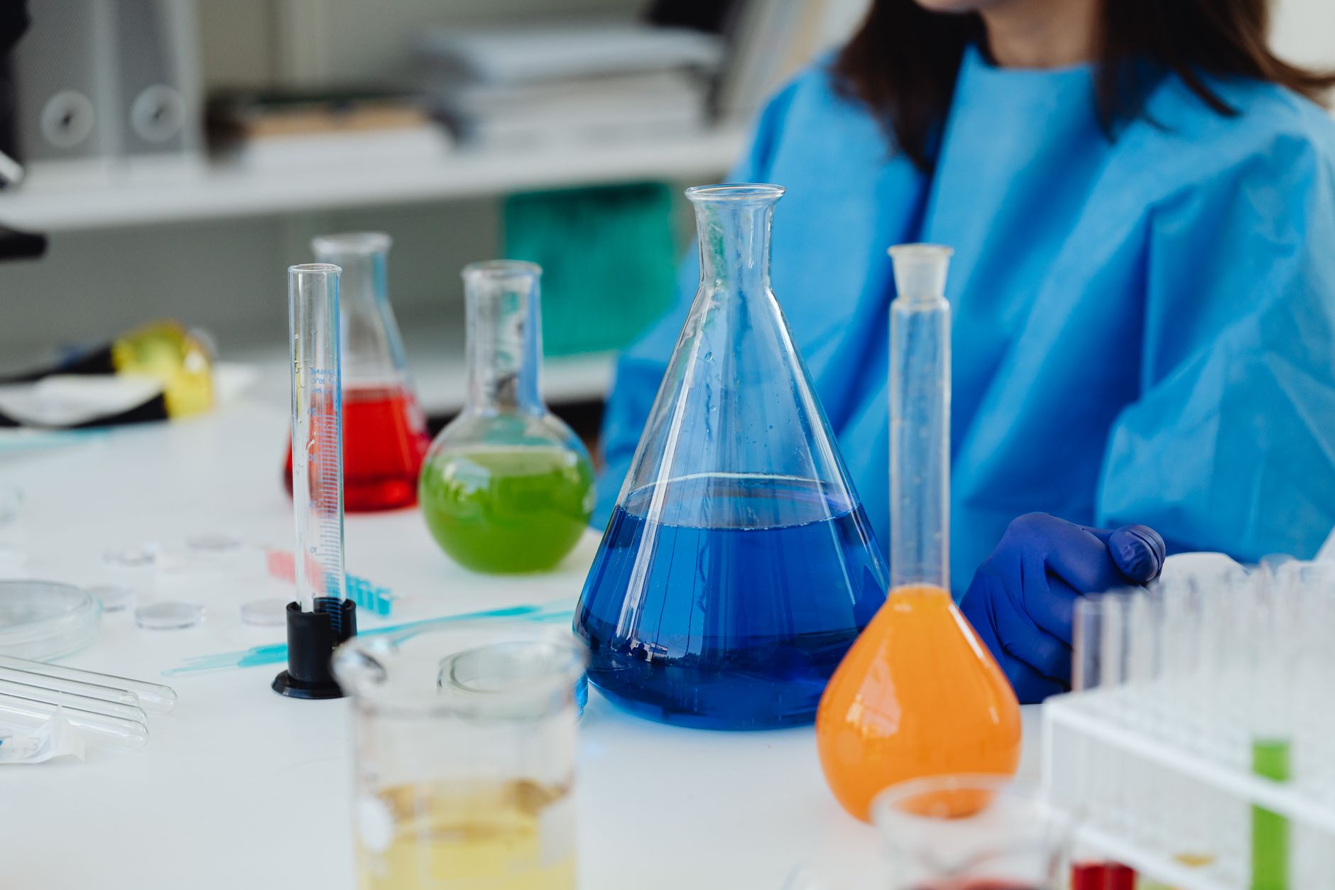 Researcher examining data on a screen in a scientific laboratory setting