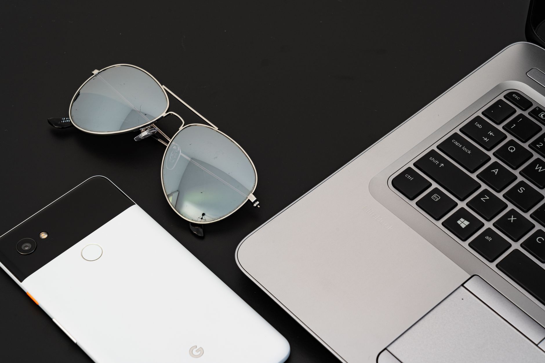 Stylish eyeglasses resting on a flat surface in soft light