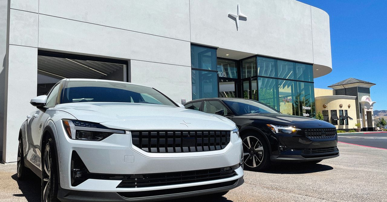 Empty electric vehicle dealership showroom with charging stations