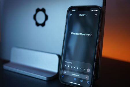 A person typing into an AI chat assistant on a laptop screen