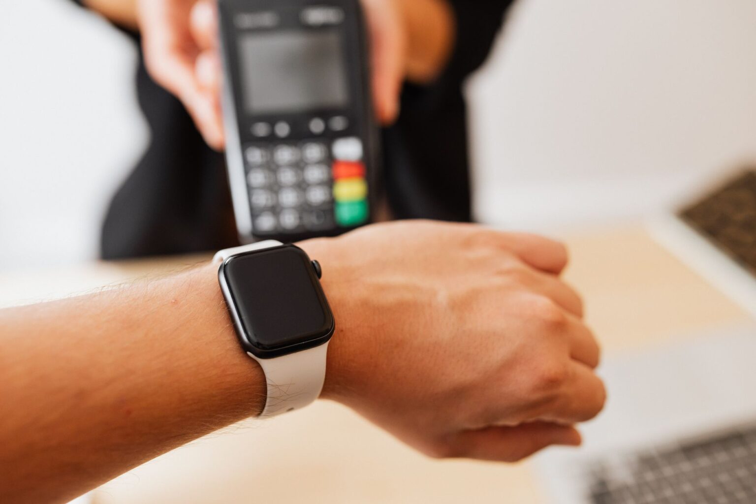 Stripe and Advent Return to PayPal With a New Acquisition Offer Person using smartphone for digital payment at a terminal