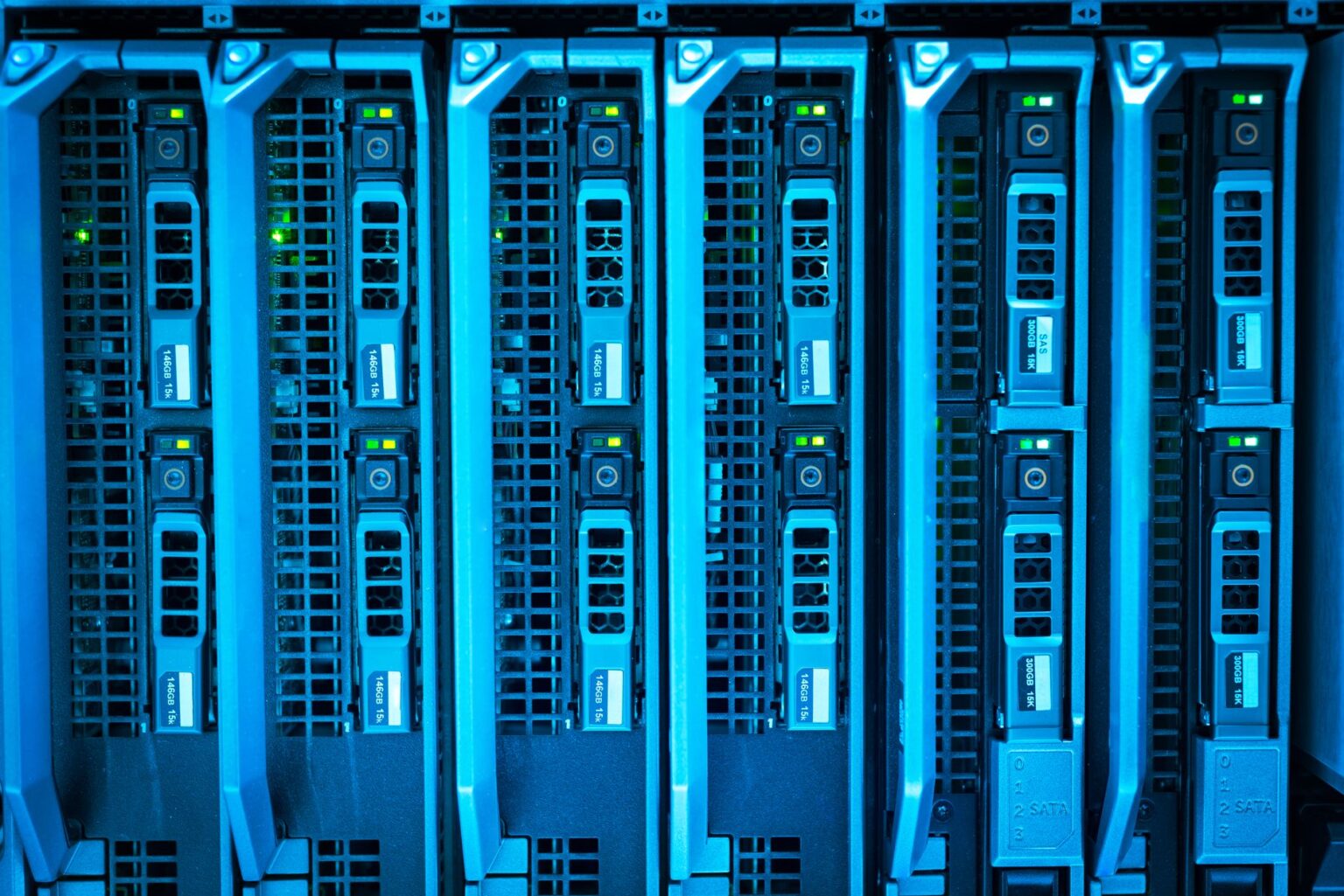 Rows of glowing data servers representing AI infrastructure and cloud computing costs