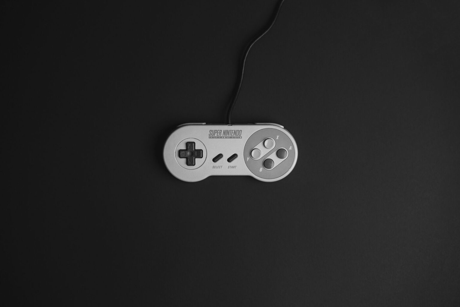 Nintendo Switch Online in 2026: Pay or Pass? A Nintendo Switch controller resting on a gaming desk in 2026