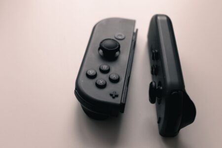 A gaming controller resting on a surface, representing the video game industry