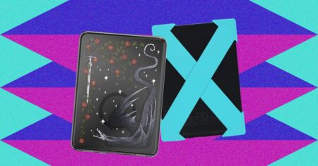 Person holding a Kindle e-reader with a protective case on a wooden surface
