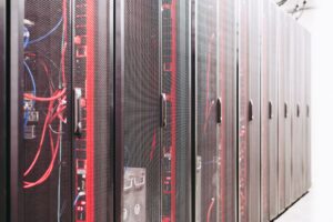 Rows of servers inside a large AI data center facility
