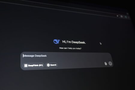 Person using an AI chat interface on a laptop to create documents