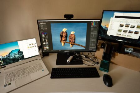 A laptop displaying a Windows desktop interface with app icons visible on the taskbar