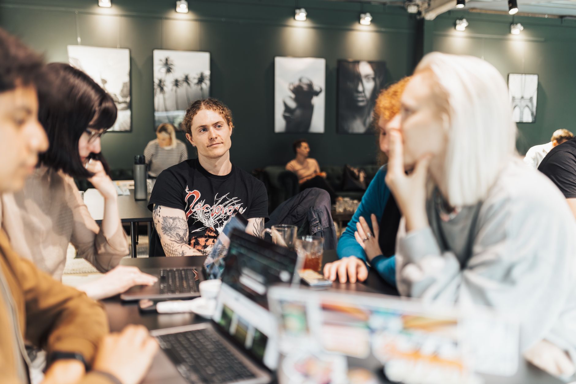 Two people working together on laptops in a shared digital workspace
