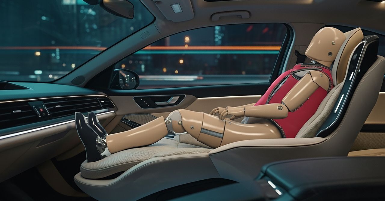 Crash test dummy seated in a vehicle during a frontal impact safety test